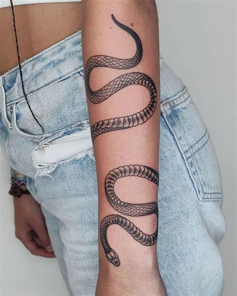 wrap around snake tattoo arm|Wrap around snake tattoo arm